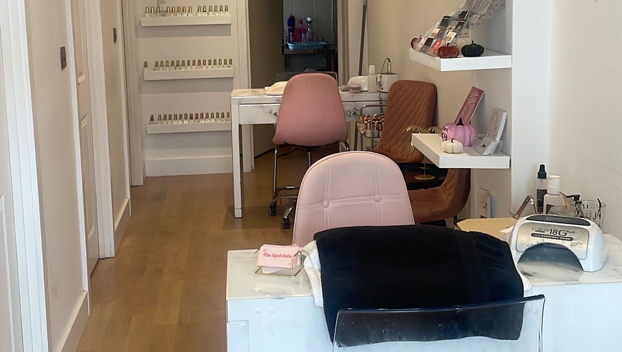 Inside Bronzed Beauty, Bournemouth, England, GB: stylish nail stations and vibrant decor for relaxing treatments.