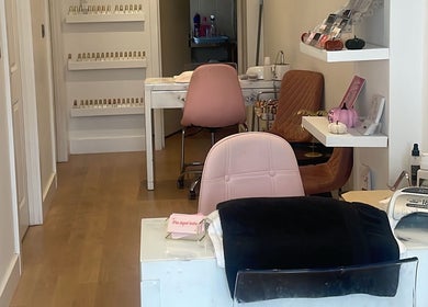 Inside Bronzed Beauty, Bournemouth, England, GB: stylish nail stations and vibrant decor for relaxing treatments.