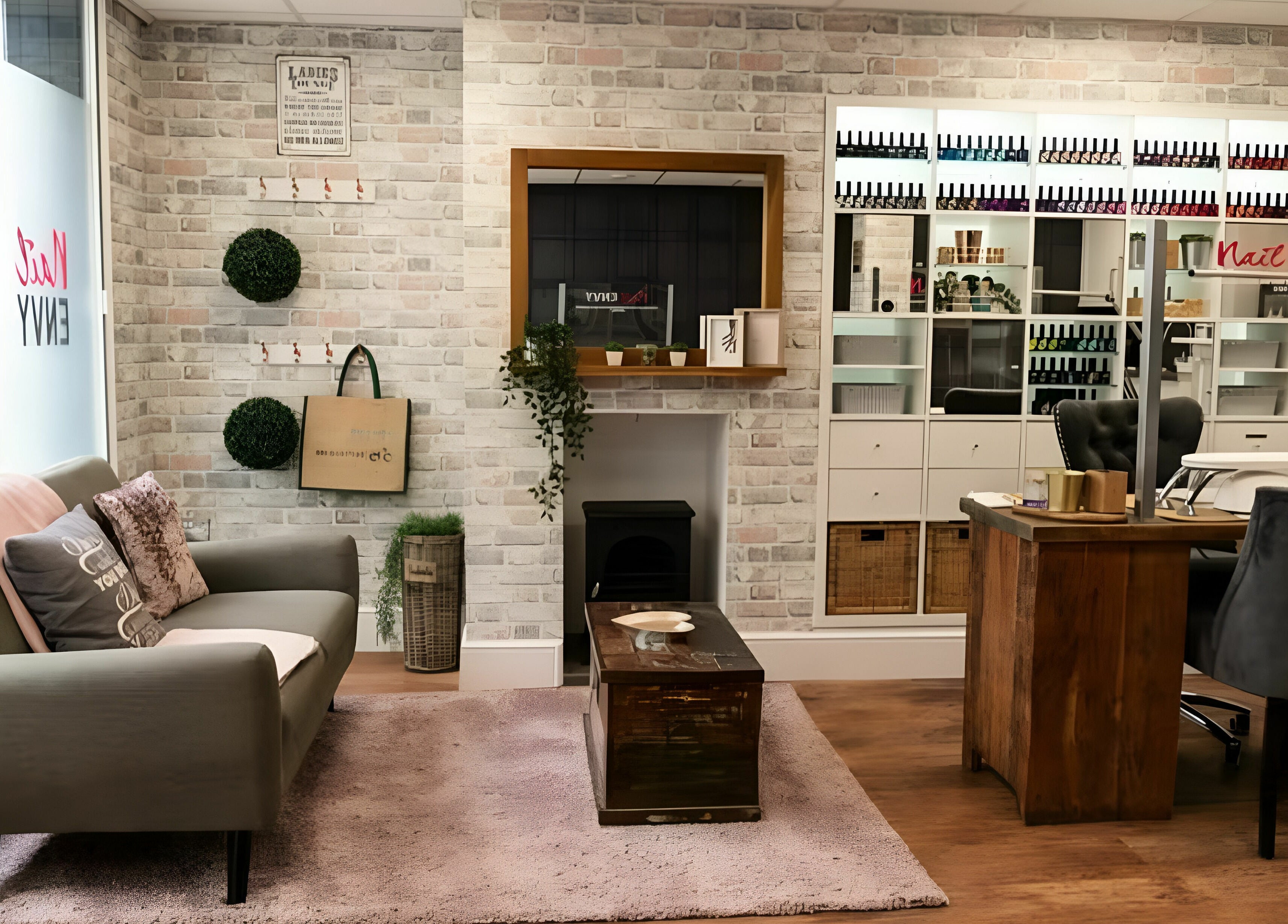Elegant interior of Nail Envy-Mid Wales in Newtown, Wales, GB showcasing cozy sofa and chic nail polish display.