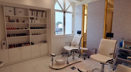 Elegant nail salon seating at Maison De Joelle- Mirdif, Dubai, AE. Bright, inviting space for beauty treatments.