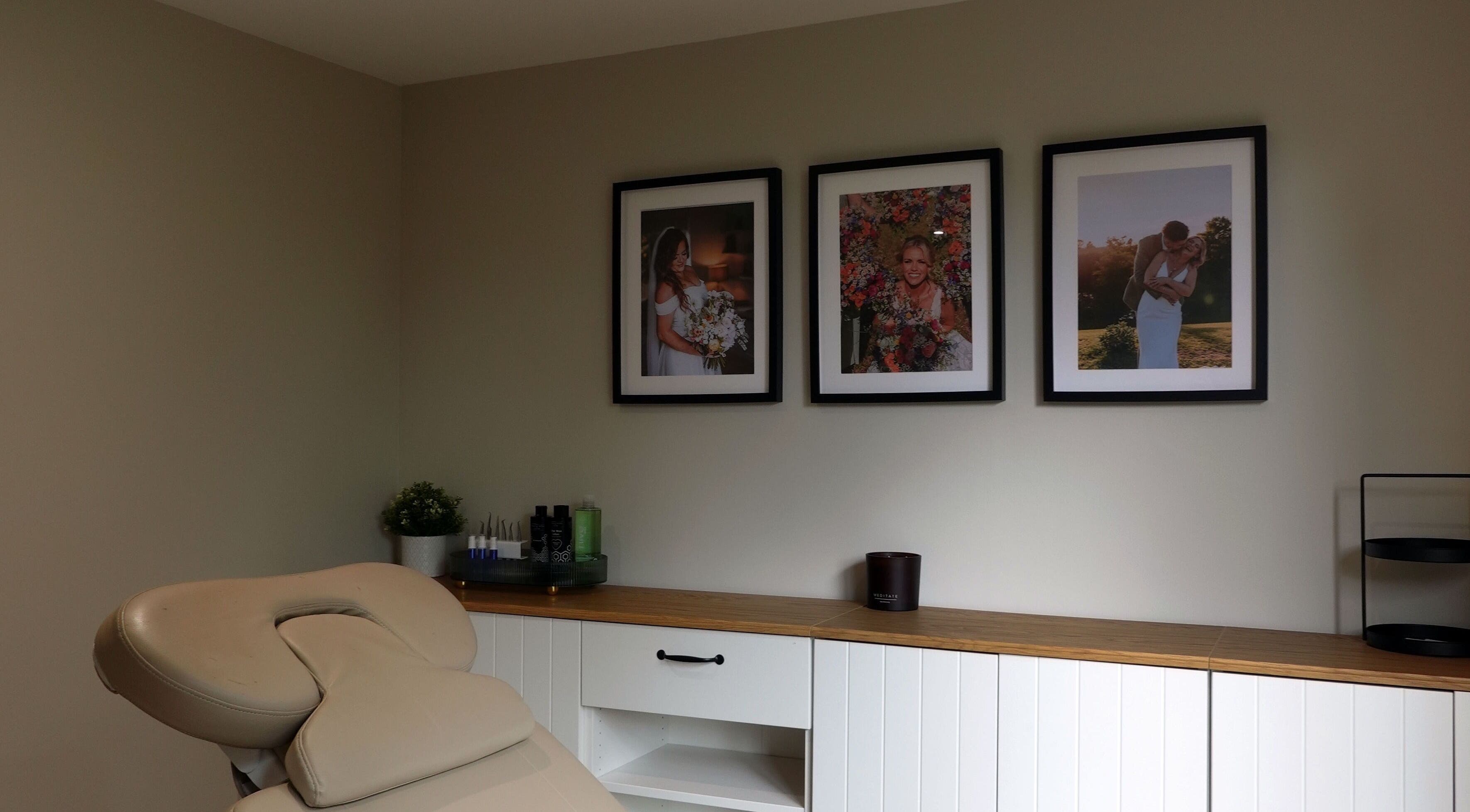 Tranquil treatment room with framed art at Emily's Beauty Studio, Budock Water, England, GB.