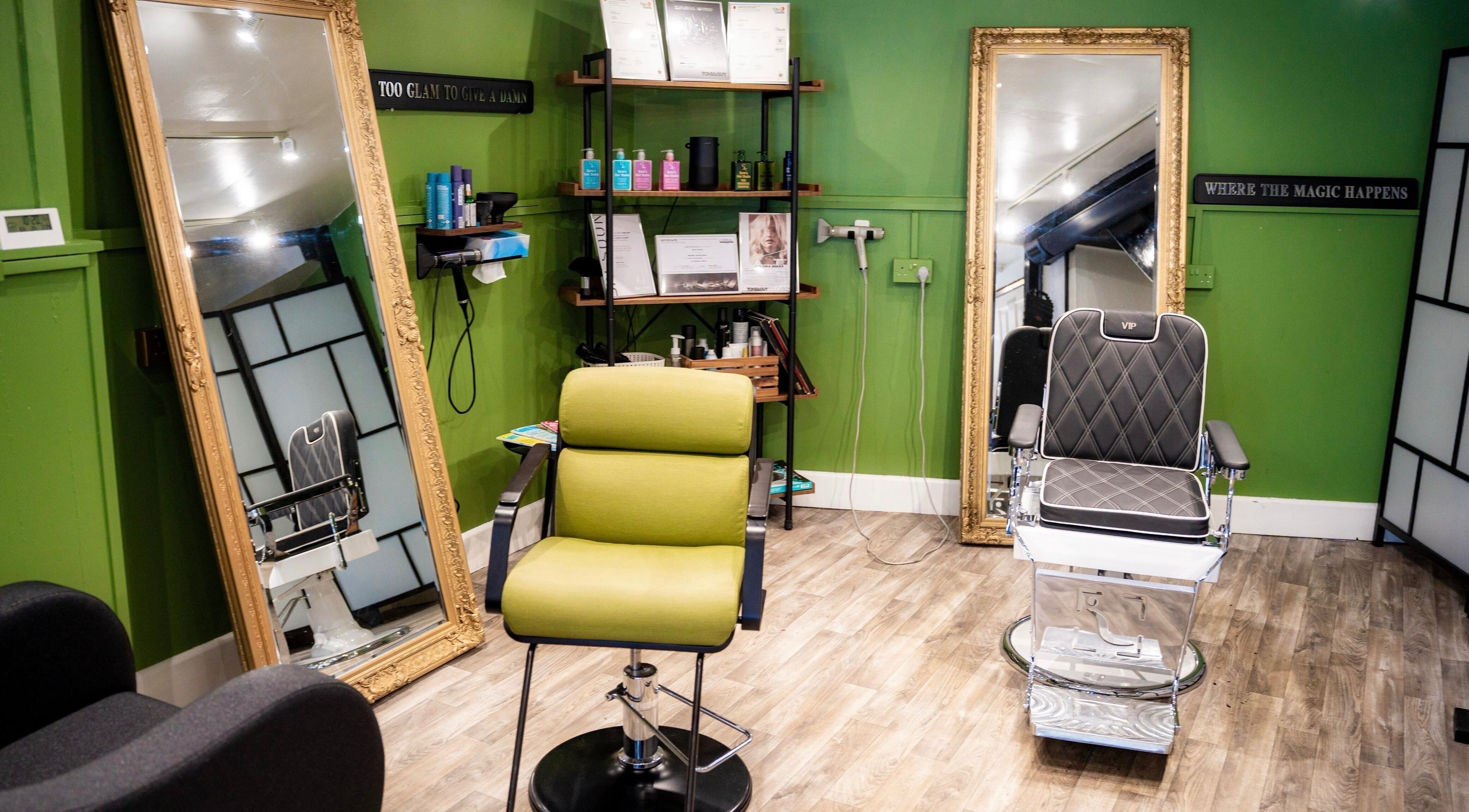 Modern salon interior at Sorin’s Hair Studio, Salisbury, England, GB with stylish chairs and mirrors.