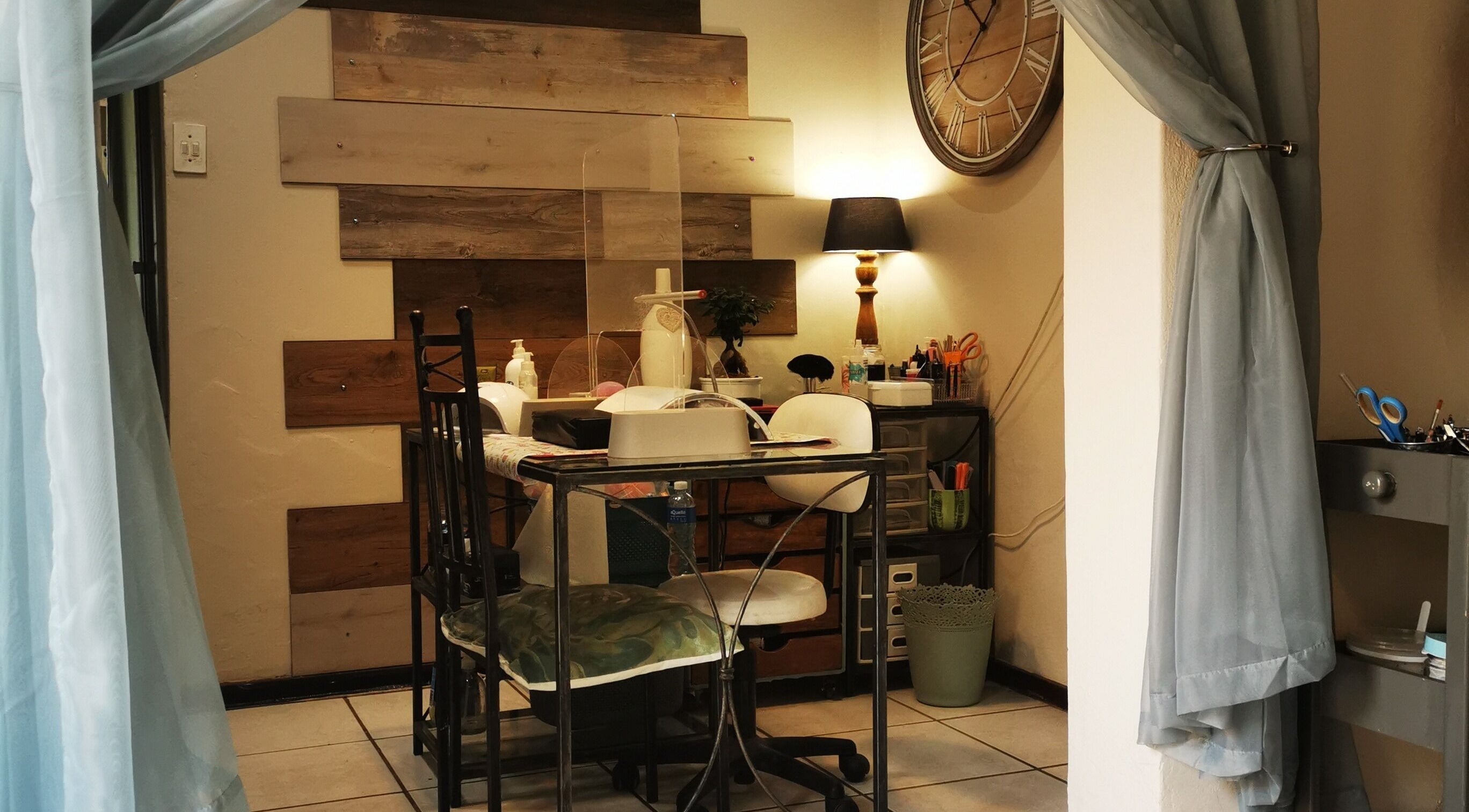 Cozy interior of E X H A L E Beauty, Boksburg, Gauteng, ZA with a stylish desk and soothing decor.