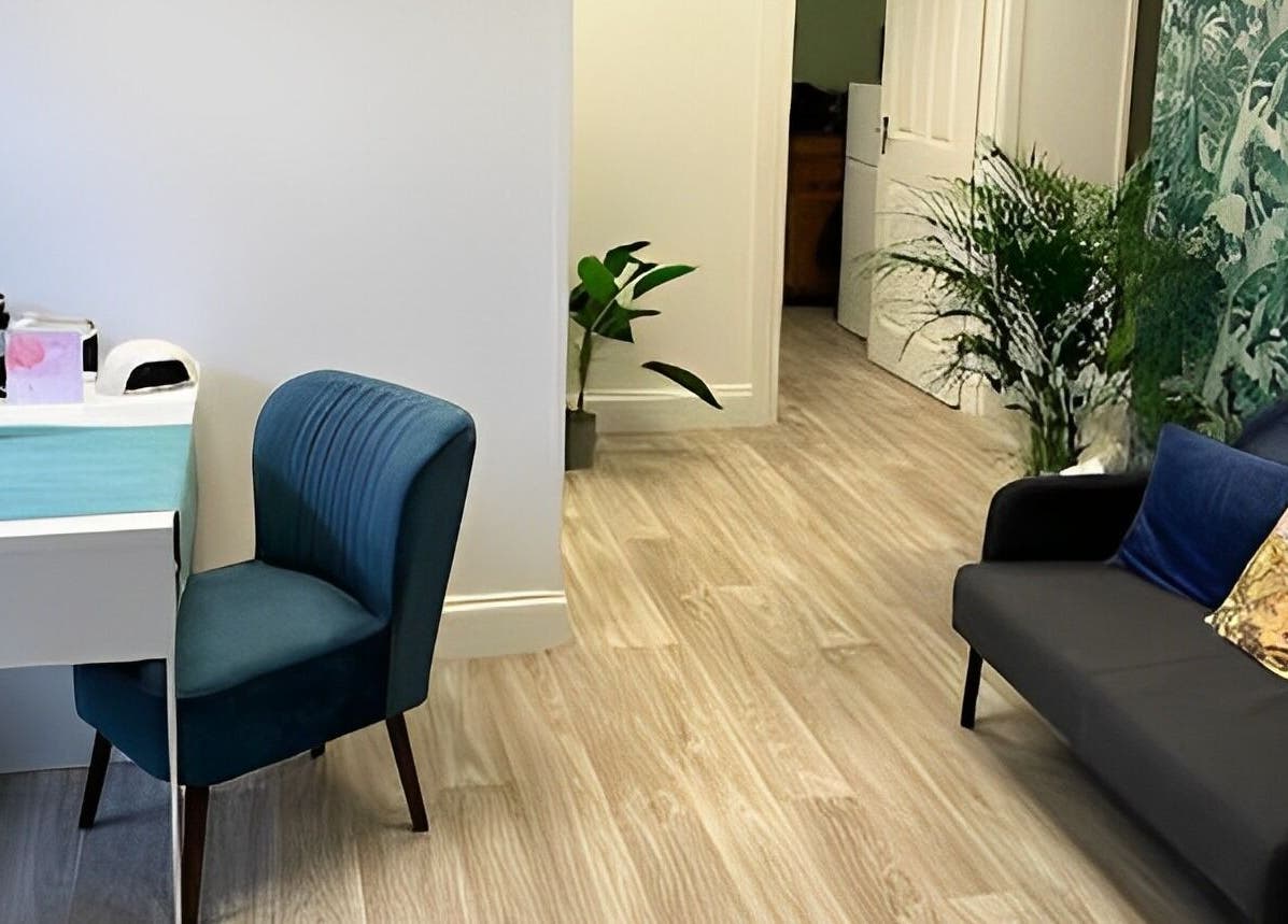 Relaxing interior of Beauty by Jaki, Falkirk, Scotland with modern decor and seating area.