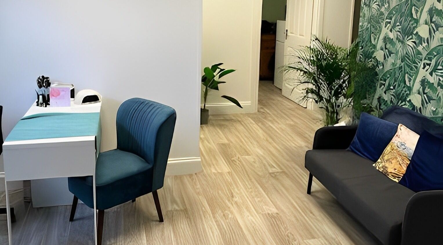 Relaxing interior of Beauty by Jaki, Falkirk, Scotland with modern decor and seating area.