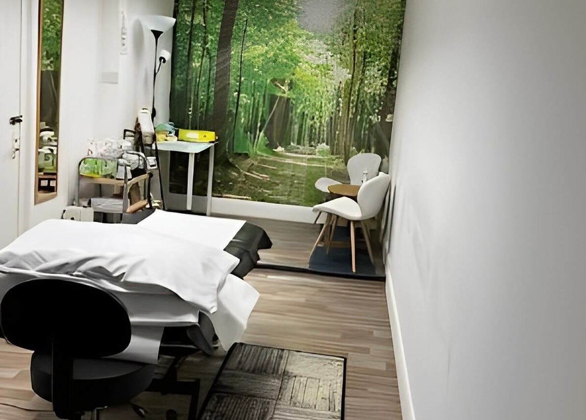 Peaceful treatment room at Beauty by Jaki in Falkirk, Scotland, GB, with forest-themed decor.