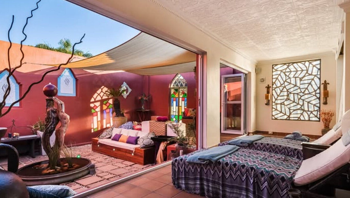 Relaxing spa area at Total Concept Salon & Spa, Gqeberha, Eastern Cape, ZA, with cozy seating and natural decor.