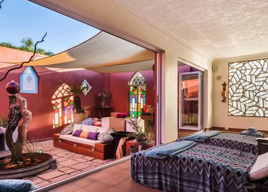 Relaxing spa area at Total Concept Salon & Spa, Gqeberha, Eastern Cape, ZA, with cozy seating and natural decor.