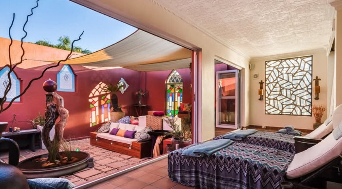 Relaxing spa area at Total Concept Salon & Spa, Gqeberha, Eastern Cape, ZA, with cozy seating and natural decor.