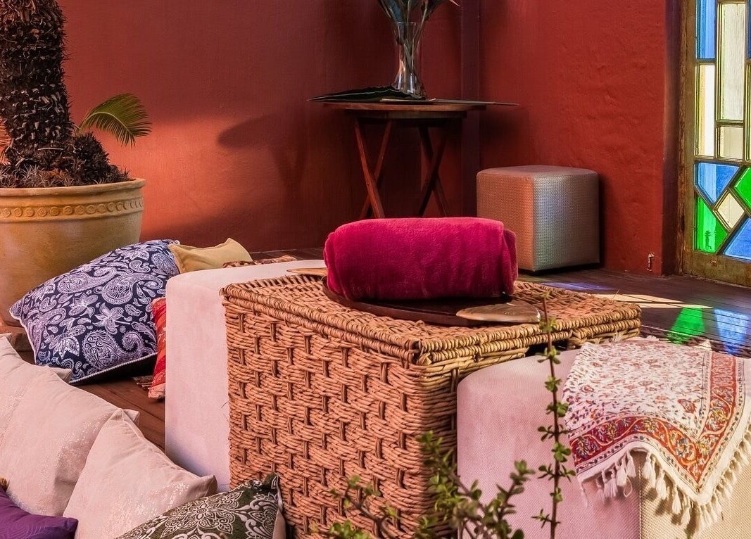 Relaxing lounge at Total Concept Salon & Spa, Gqeberha, Eastern Cape, ZA with colorful stained glass lighting.