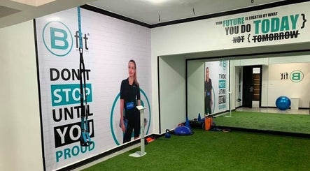 Interior of Body Fit Egypt EMS Maadi Branch, Cairo: workout area with motivational posters and fitness equipment.
