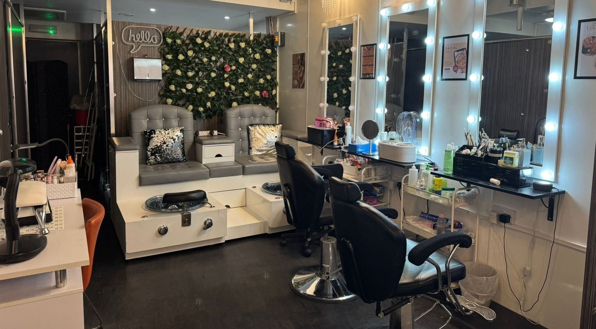 Chic interior of Beauty Lounge MK Ltd in Milton Keynes, England with plush seating and elegant mirrors.