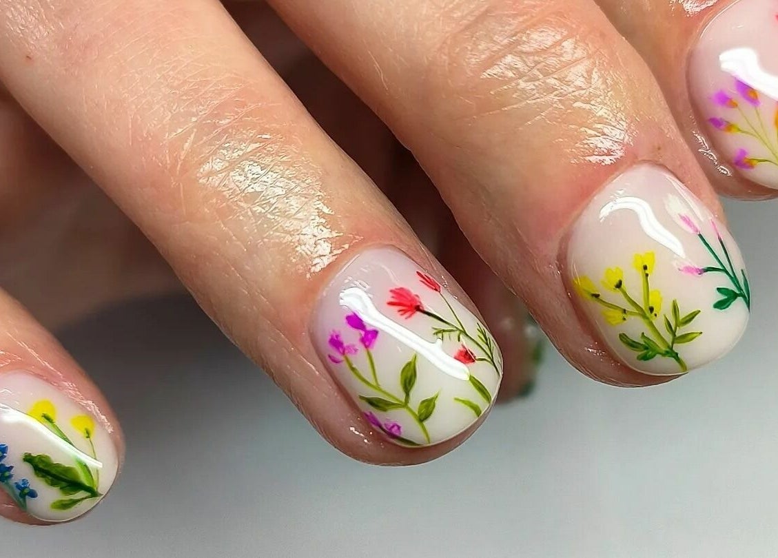 Detailed floral nail art at The Green Sanctuary, Swadlincote, England, GB offering vibrant beauty treatments.