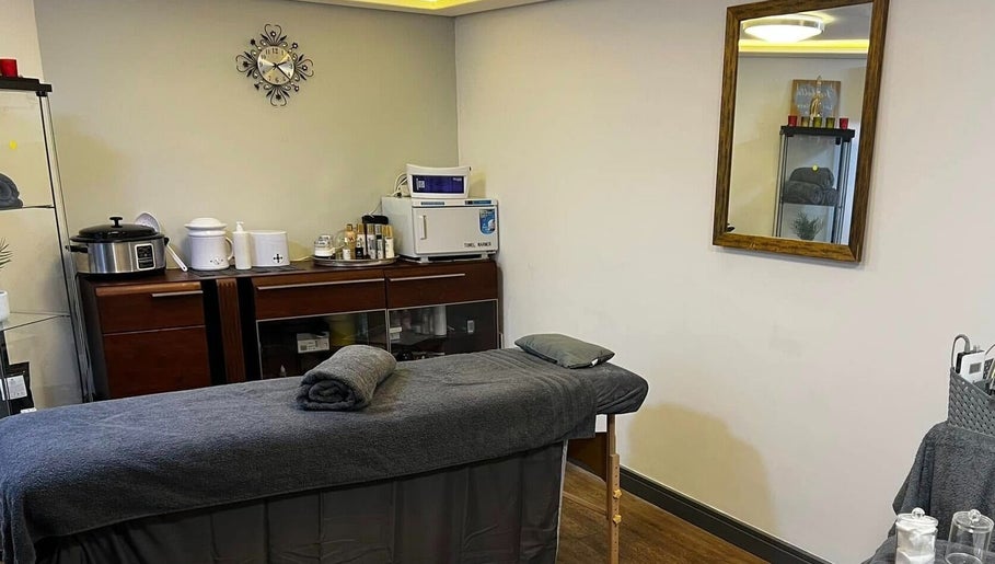 Cozy massage room at Bk's Beauty in Milton Damerel, England, GB with a treatment table and relaxing decor.