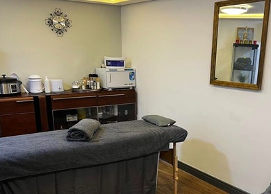 Cozy massage room at Bk's Beauty in Milton Damerel, England, GB with a treatment table and relaxing decor.