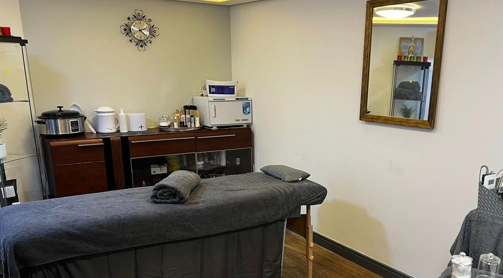 Cozy massage room at Bk's Beauty in Milton Damerel, England, GB with a treatment table and relaxing decor.