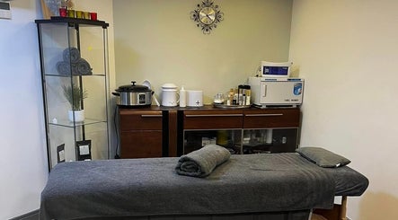 Bk's Beauty spa room with massage table in Milton Damerel, England, GB.