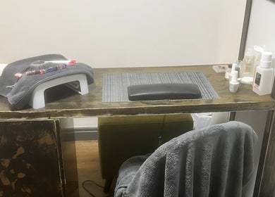 Nail care station at Bk's Beauty in Milton Damerel, England, GB, featuring nail tools and products.