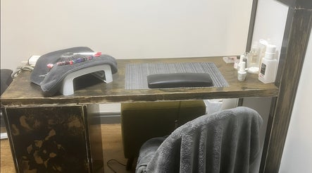 Nail care station at Bk's Beauty in Milton Damerel, England, GB, featuring nail tools and products.