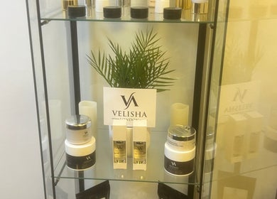 Beauty products displayed on a glass shelf at Bk's Beauty, Milton Damerel, England, GB.