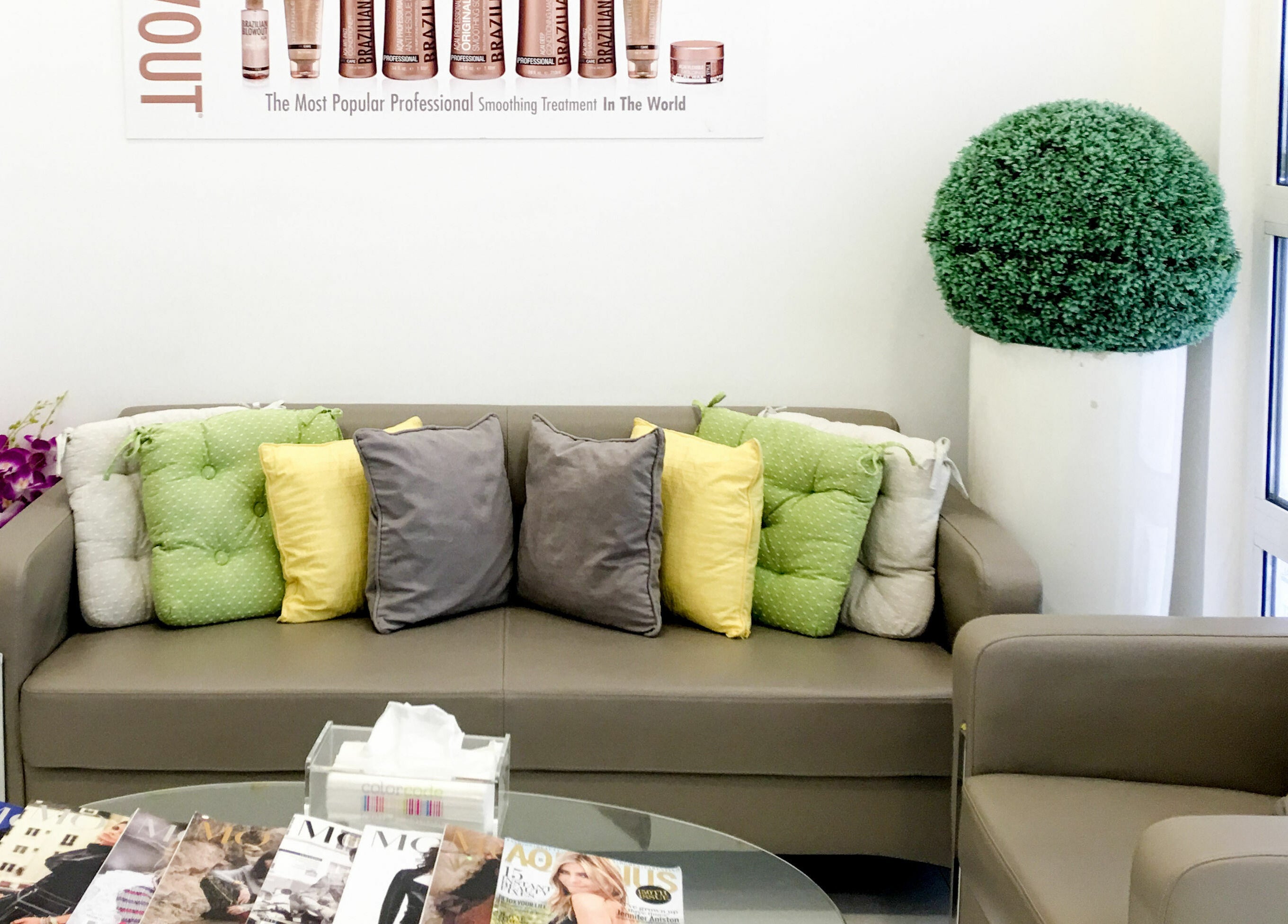 Cozy seating area at Colorcode Emirates Garden 2 Jumeirah Village Circle, Dubai, Dubai, AE, with colorful cushions.