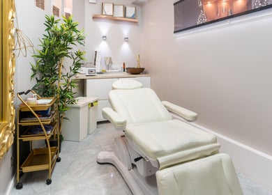 Treatment room with a plush chair at Trends Aesthetic Beauty Salon, London, England, GB.