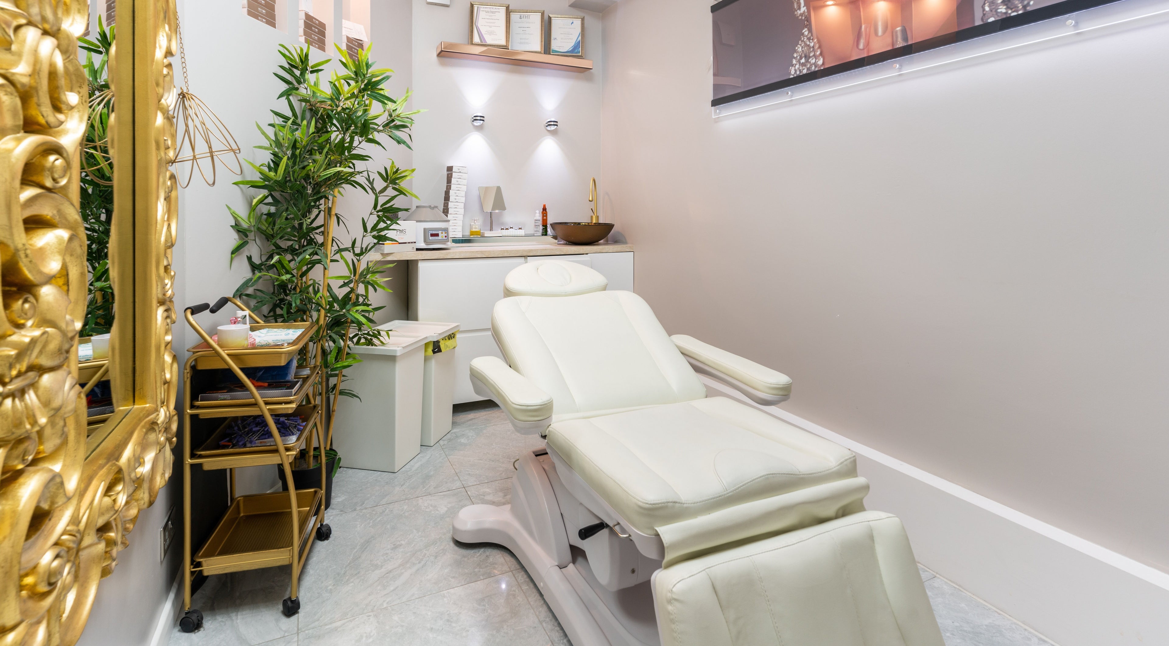 Luxurious treatment room at Trends Aesthetic Beauty Salon in London, England, GB with plush white chair.