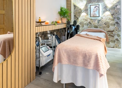 Serene treatment room at Trends Aesthetic Beauty Salon in London, England, GB. Cozy spa ambiance with modern equipment.