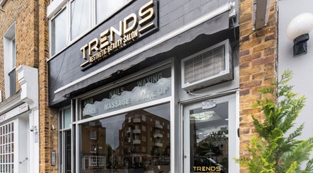 Exterior of Trends Aesthetic Beauty Salon in London, England, GB, showcasing stylish signage and modern design.