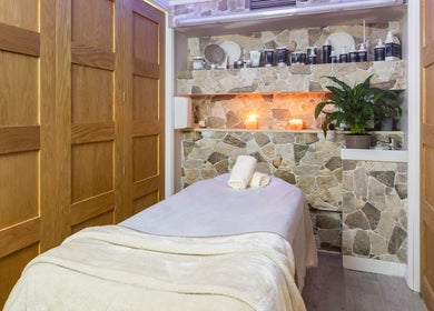 Relaxing spa treatment room at Trends Aesthetic Beauty Salon, London, England, GB with ambient lighting.