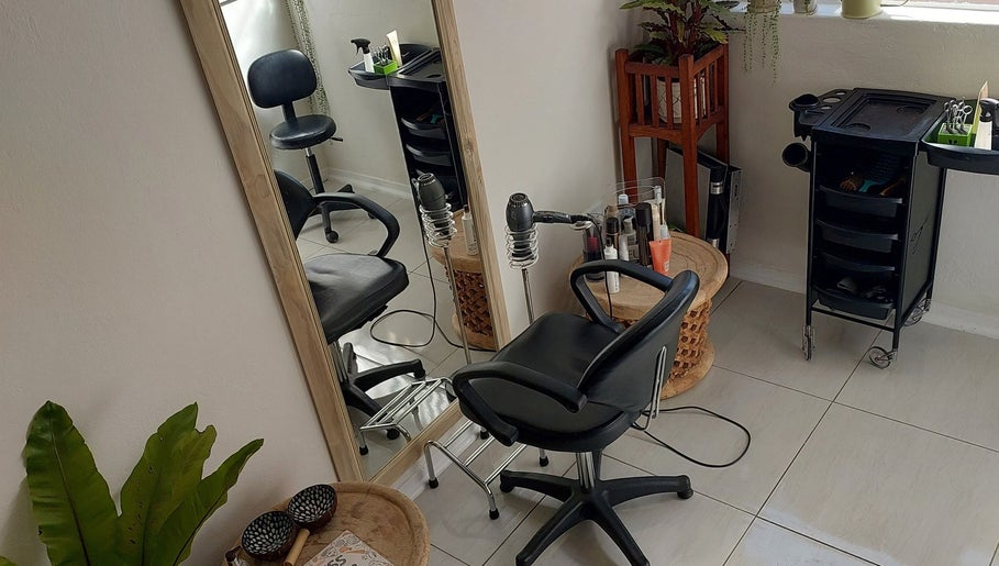 Modern salon interior at Hair By Amanda, Sandton, Gauteng, ZA showcases styling chair and mirror setup.