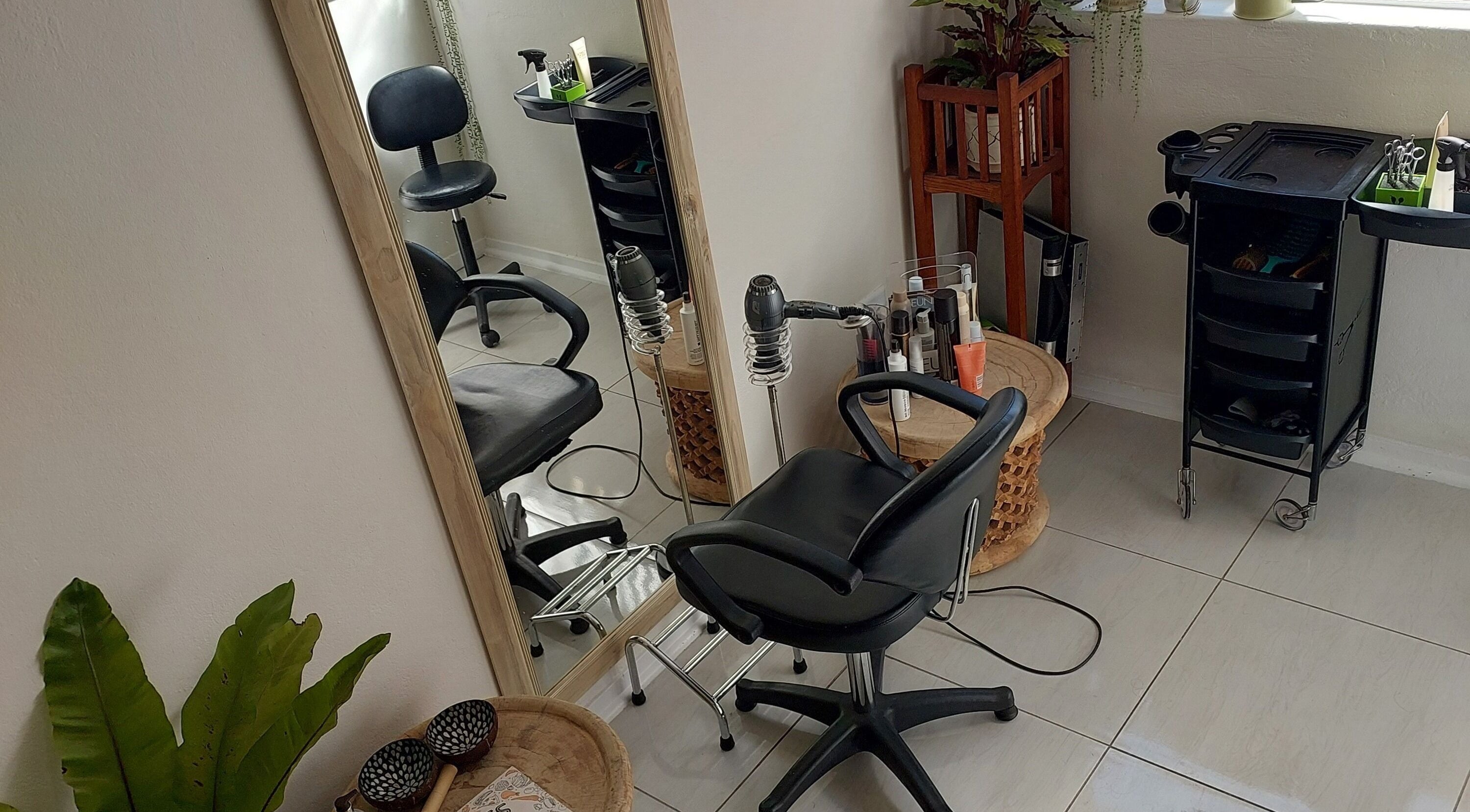Modern salon interior at Hair By Amanda, Sandton, Gauteng, ZA showcases styling chair and mirror setup.