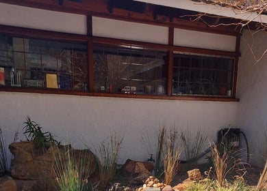 Beautiful exterior view of Hair By Amanda in Sandton, Gauteng, ZA, featuring rustic design and lush garden.