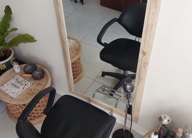 Calm salon corner at Hair By Amanda with a chair and mirror in Sandton, Gauteng, ZA.