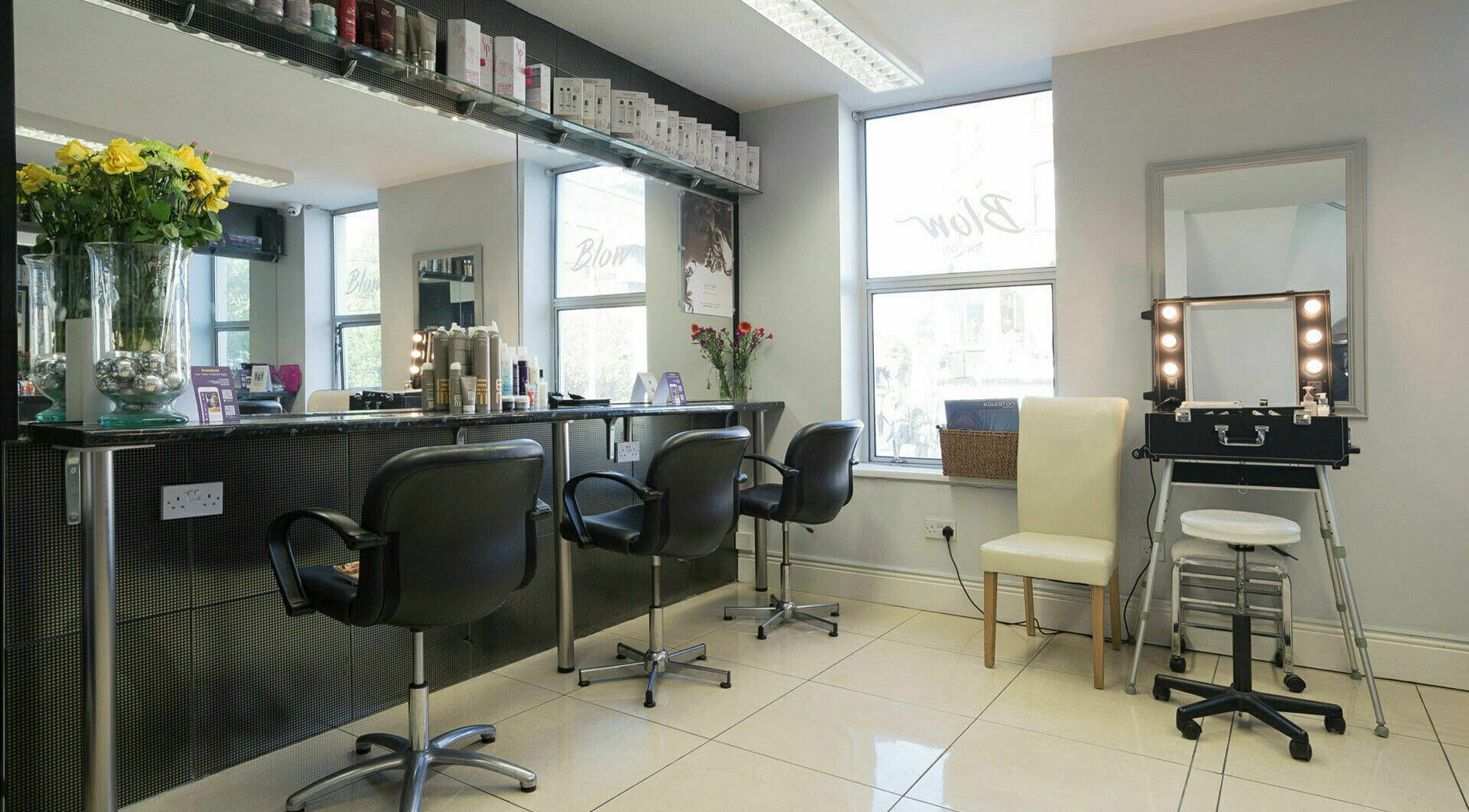 Modern salon interior at Blow Leeson Street, Dublin, County Dublin, IE, featuring sleek styling stations.