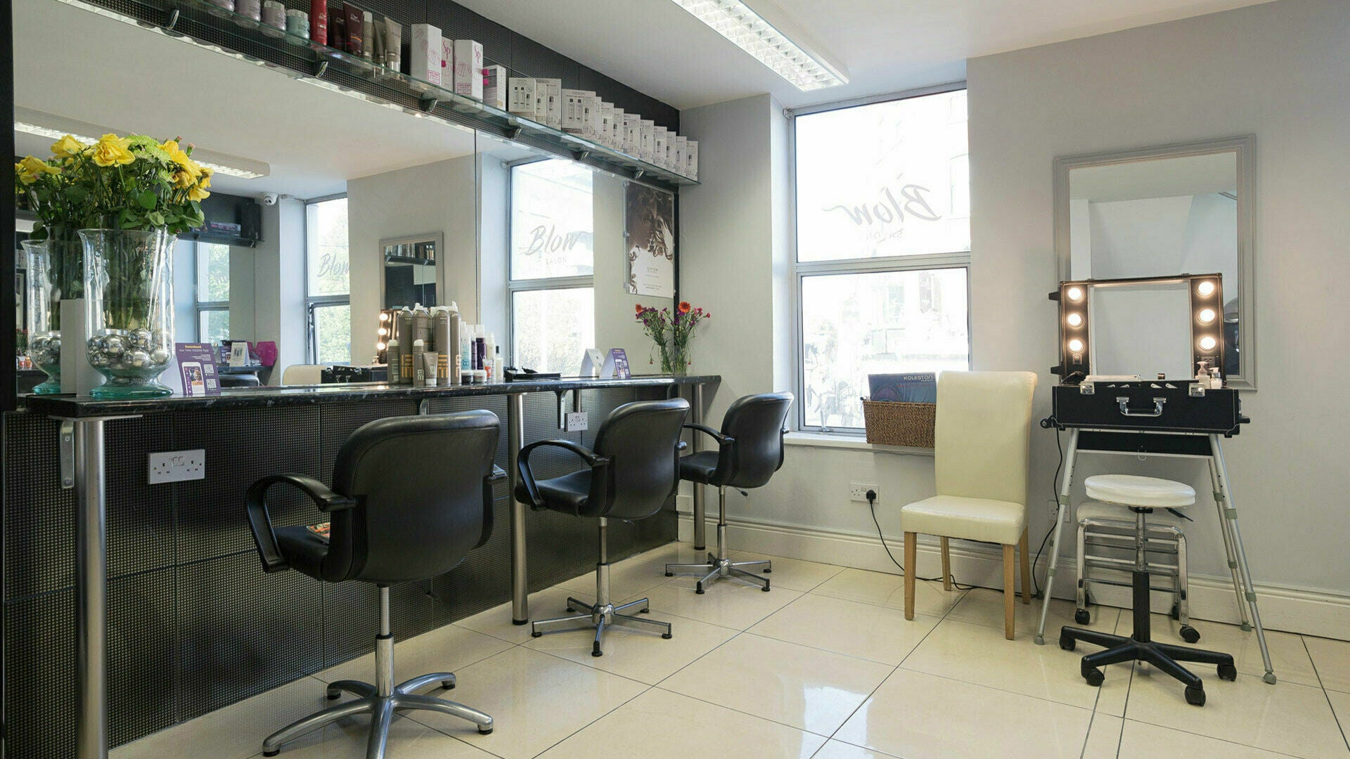Modern salon interior at Blow Leeson Street, Dublin, County Dublin, IE, featuring sleek styling stations.