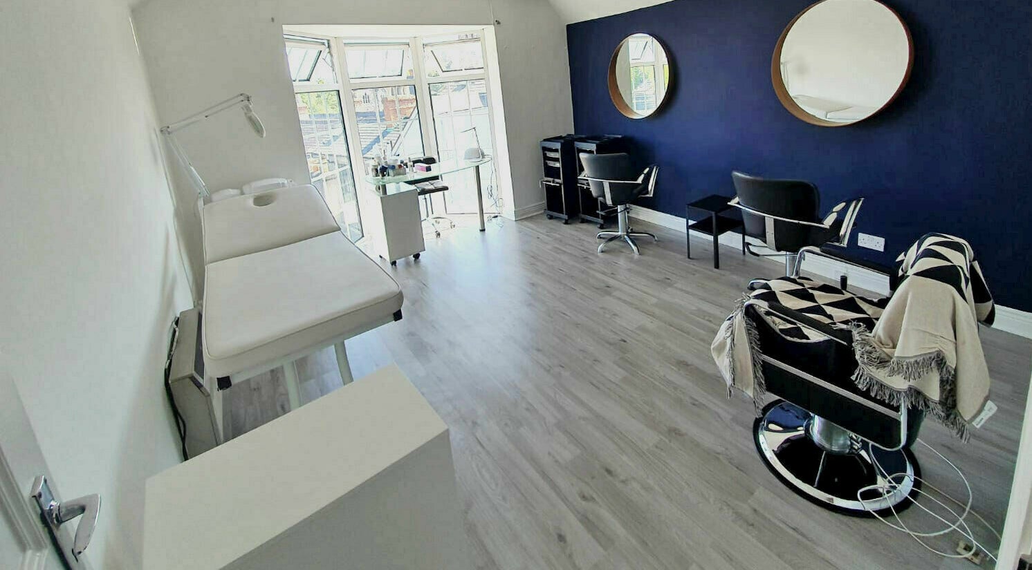 Stylish salon interior at Blow Leeson Street, Dublin, County Dublin, IE, featuring modern chairs and mirrors.