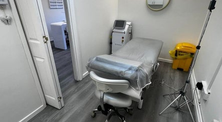 Treatment room at Salon Angels Beauty & Aesthetics, Caerphilly, Wales, GB, featuring a massage bed and equipment.