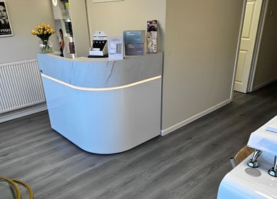 Reception area at Salon Angels Beauty & Aesthetics, Caerphilly, Wales, GB with modern decor and cozy ambiance.