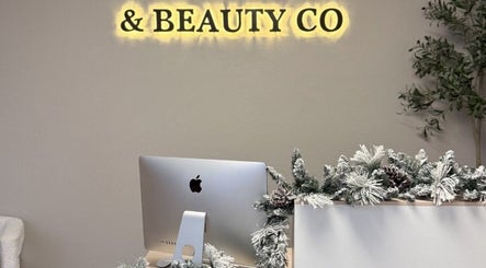 Reception desk at & Beauty Co. with festive decor in Citrus Heights, California, US.