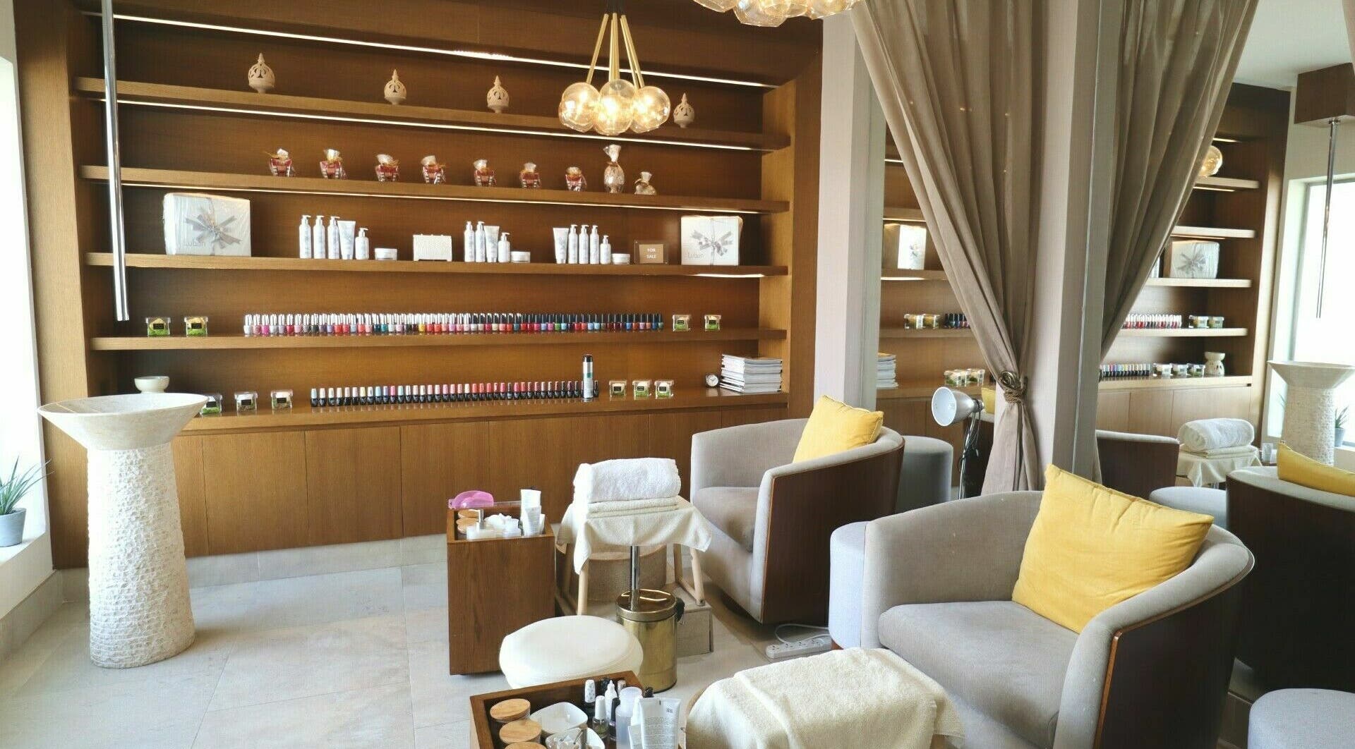 Inviting seating and nail polish display in Luban Spa, Dubai, AE for a serene and luxurious experience.