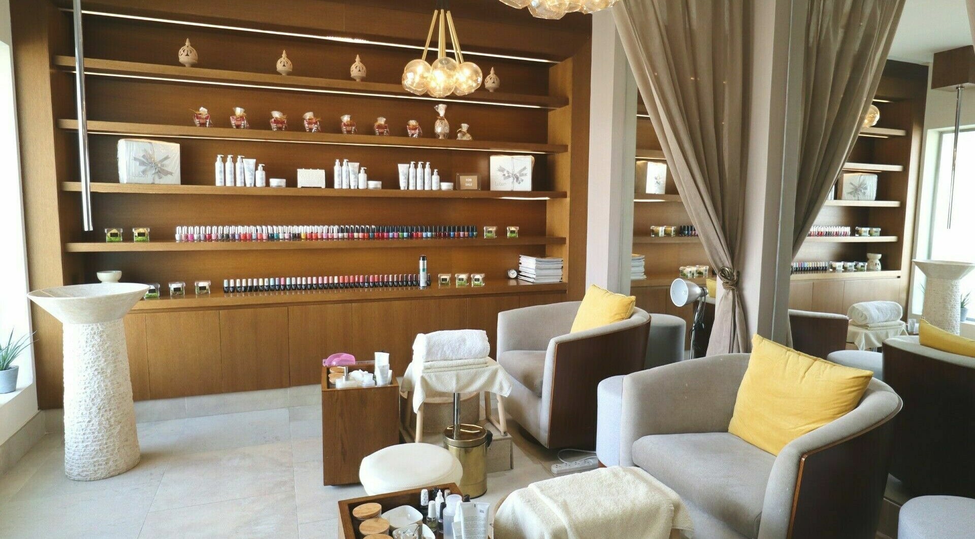 Inviting seating and nail polish display in Luban Spa, Dubai, AE for a serene and luxurious experience.