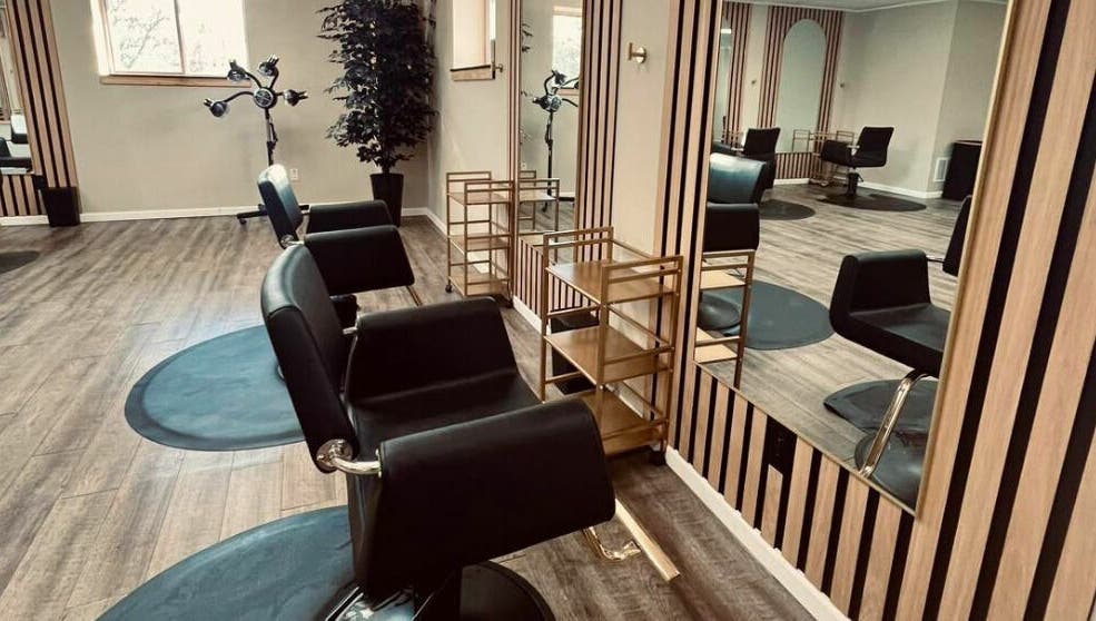 Chic interior at The Babe Kave, Flint, Michigan, US with stylish salon chairs and modern decor.