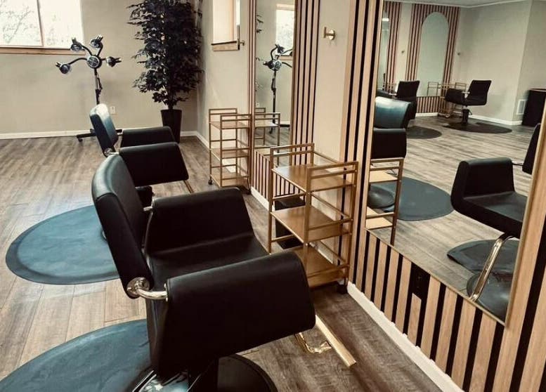 Chic interior at The Babe Kave, Flint, Michigan, US with stylish salon chairs and modern decor.