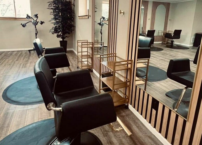 Chic interior at The Babe Kave, Flint, Michigan, US with stylish salon chairs and modern decor.