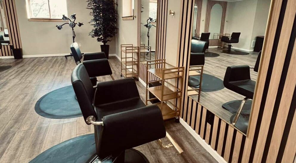 Chic interior at The Babe Kave, Flint, Michigan, US with stylish salon chairs and modern decor.