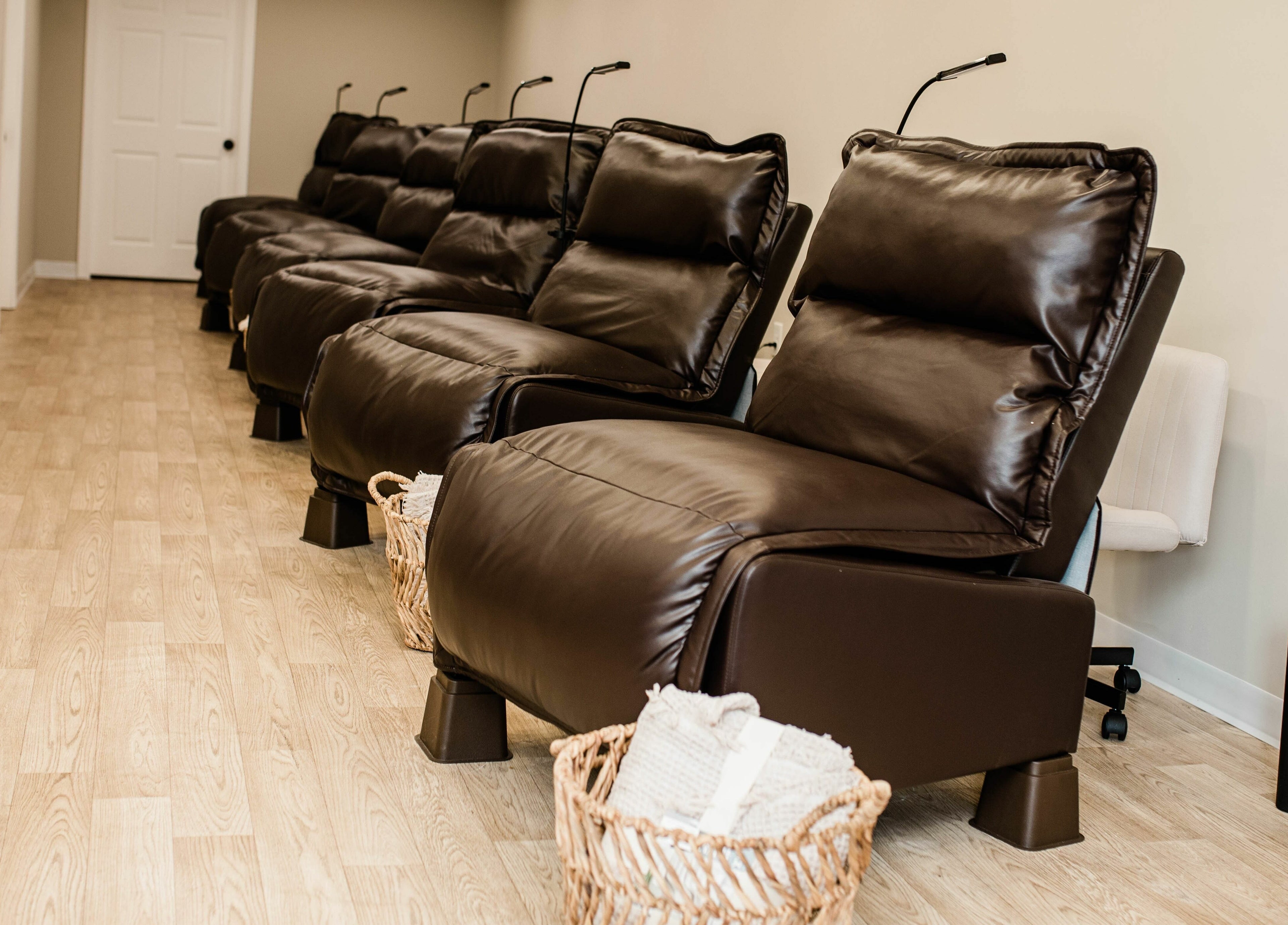 Elegant leather recliners at The Babe Kave, Flint, Michigan, US, offering a tranquil wellness experience.