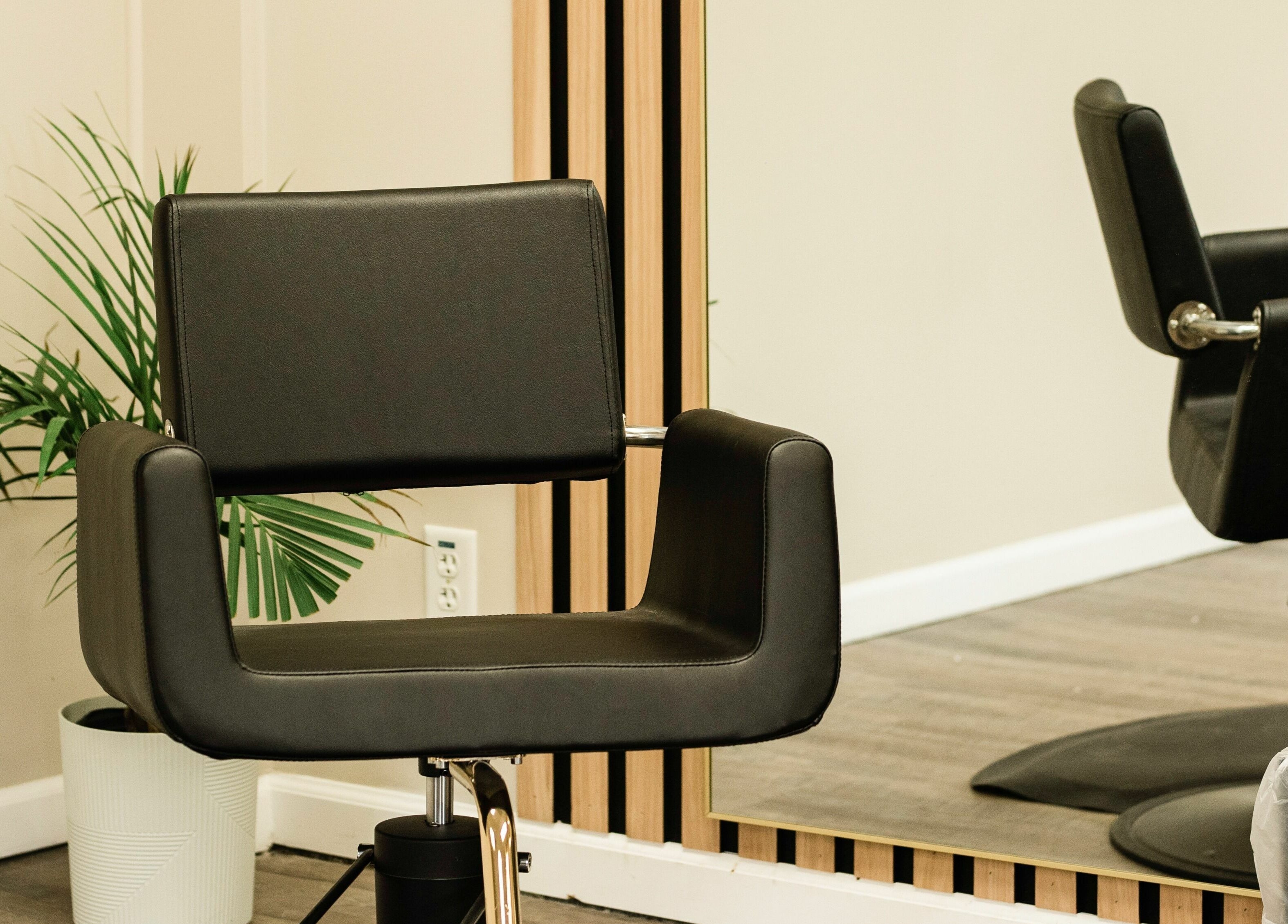 Sleek salon chair at The Babe Kave in Flint, Michigan, US, enhancing the chic ambiance.