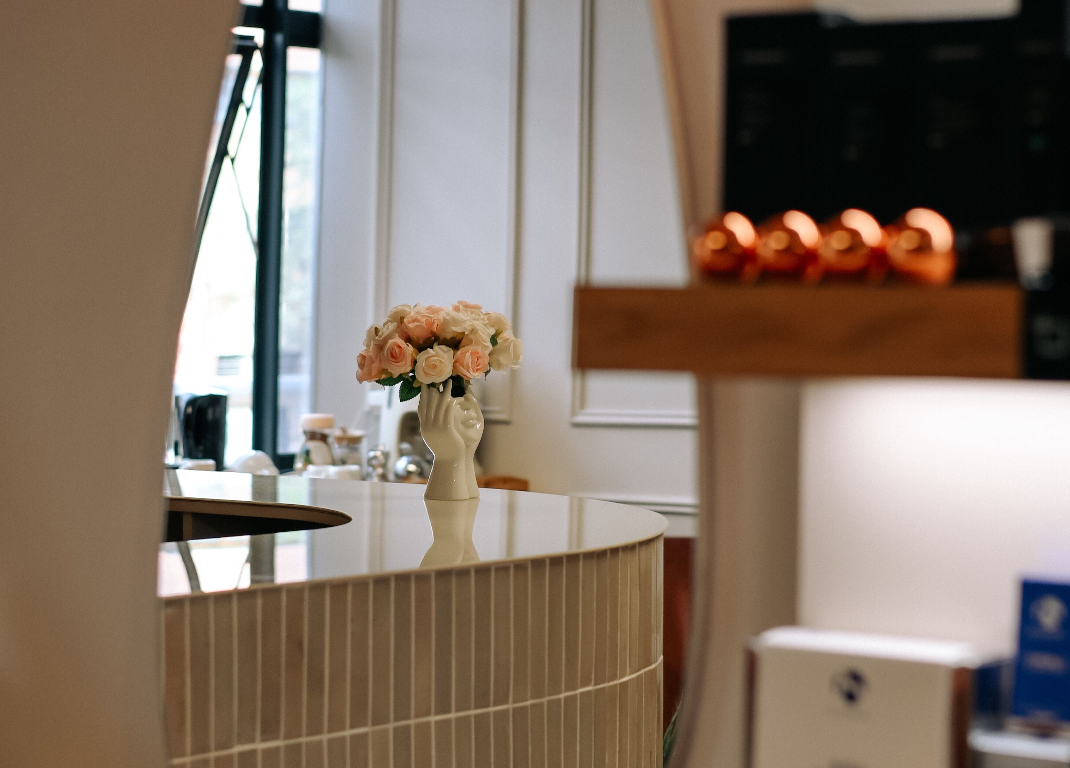 Elegant reception desk with flowers at Young Again Aesthetics, Sandton, Gauteng, ZA.