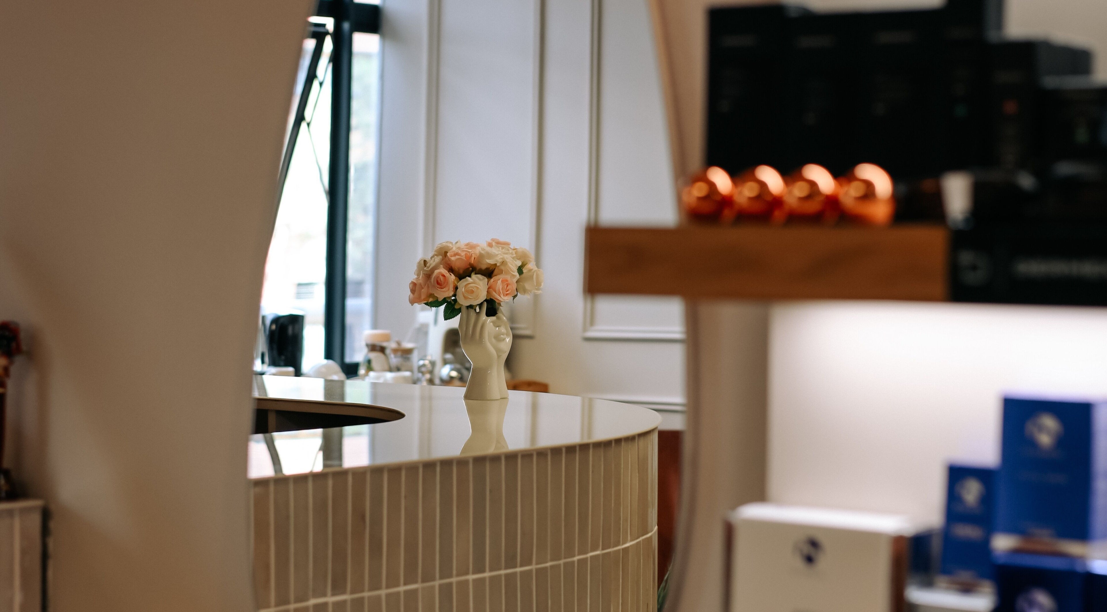 Elegant reception desk with flowers at Young Again Aesthetics, Sandton, Gauteng, ZA.